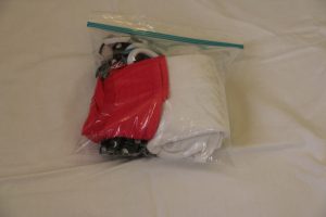 Fold up swim gear and put into a plastic bag. Toss into beach bag. And when you leave the beach, throw the wet items in the baggie.